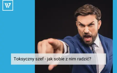 Wściekły mężczyzna w garniturze wskazuje palcem, ukazując cechy toksycznego szefa.